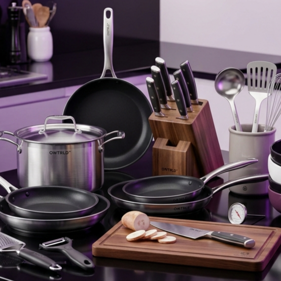 A beautifully organized, modern kitchen featuring OWTRLD high-performance cookware and minimalist serving accessories on a sleek marble countertop