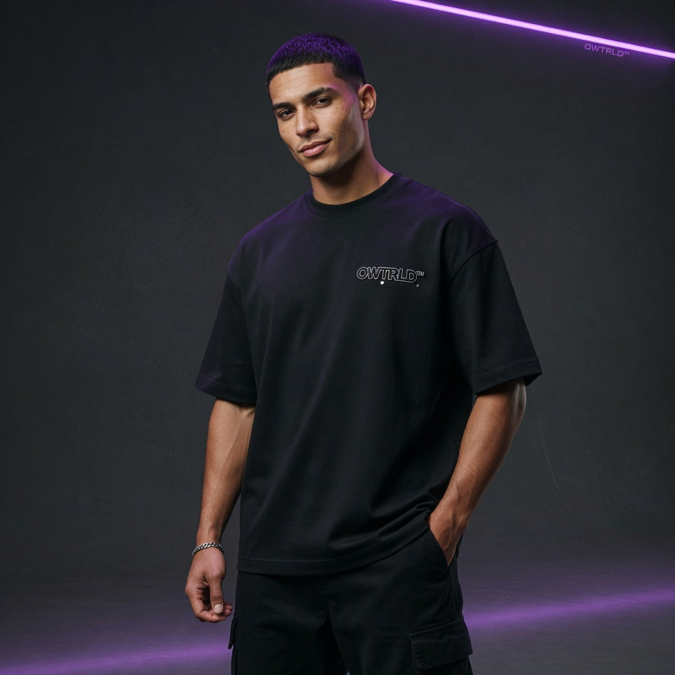 A diverse collection of OWTRLD premium men’s t-shirts featuring modern graphic designs and minimalist styles, high-quality fabric photography
